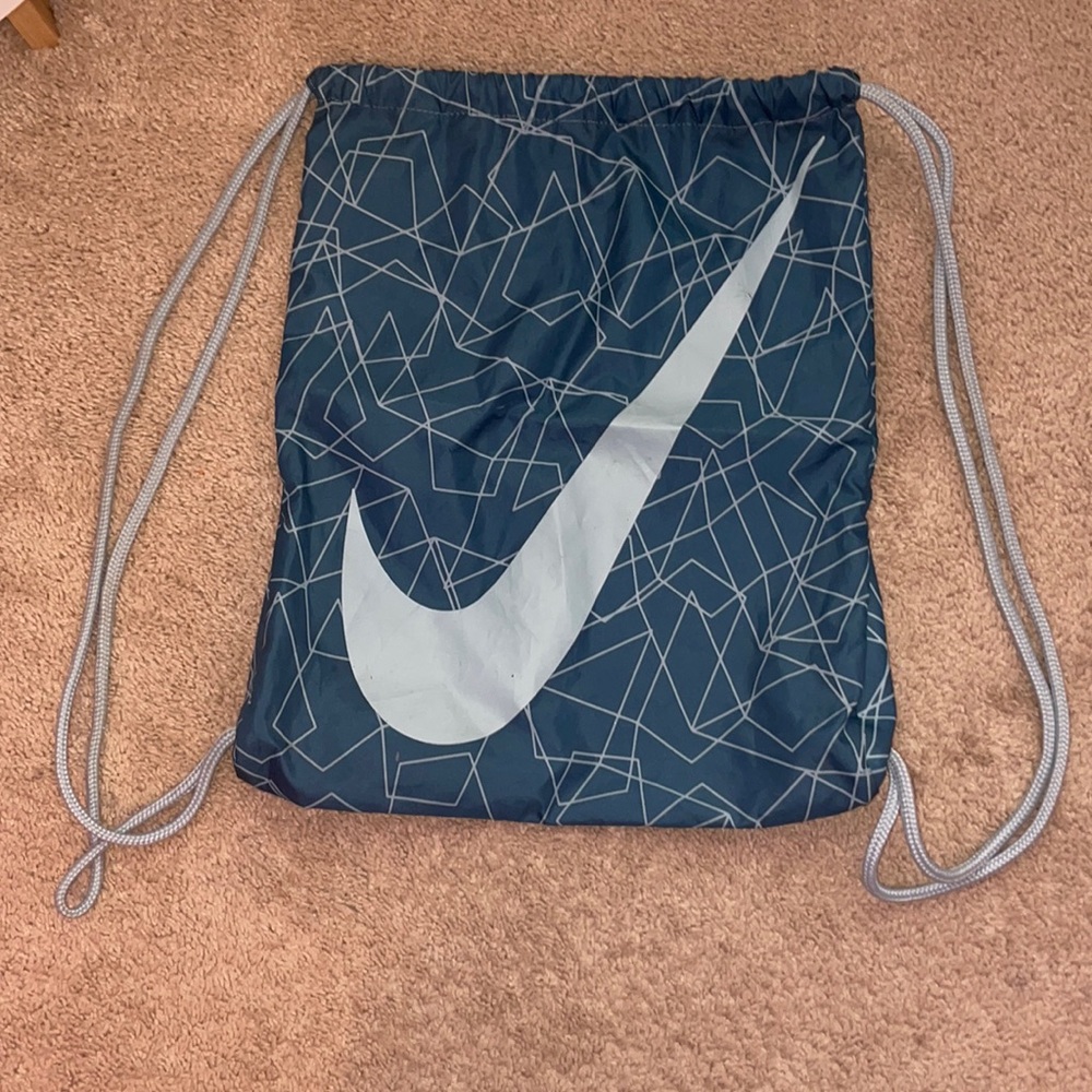 Nike blue gently use drawstring bag perfect for traveling or theme parks
